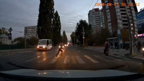 Car Swerves Around Pedestrian at the Last Moment