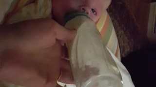 Nursing baby extremely startled by sneezing mom