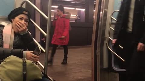 Shirtless man exercises and runs in place at a subway station