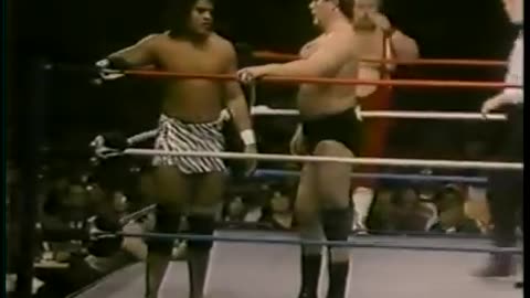 dec. 22-1984-tony atlas while Brutus beefcake struts his stuff at ringside