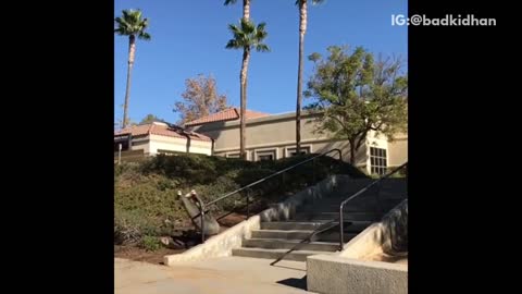 Guy black shirt skateboard fall back on rail