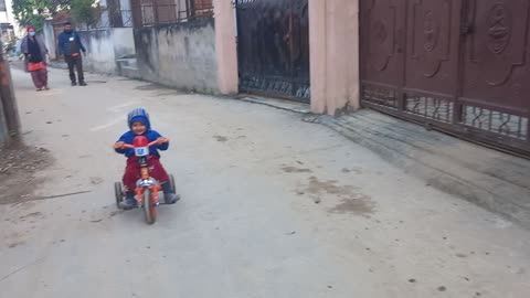 Cute baby cycling