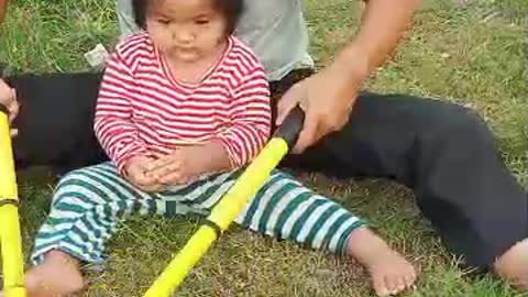 Father and Duaghter are cutting ther grass