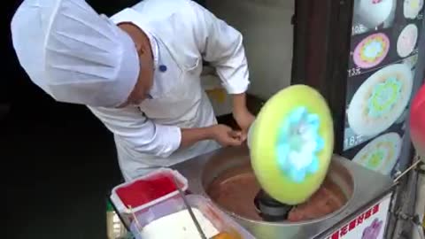 Cotton Candy Making in the street of china town.