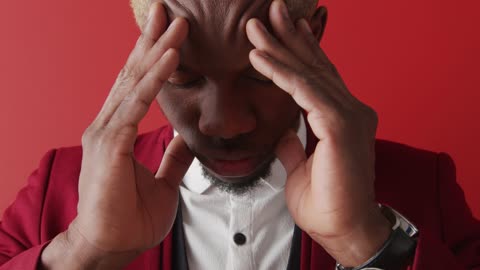 Close Up of a Man Holding his Head