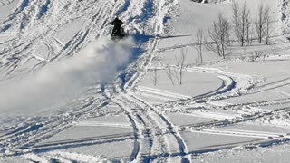 Snowmobile Tries to Climb Super Steep Hill