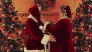 Santa and Mrs. Claus dance the christmas carlton
