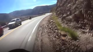Quick-Thinking Biker Dodges Lorry Overtaking On Bend