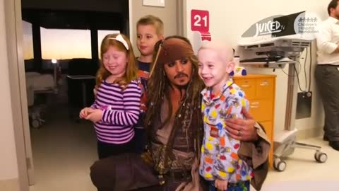 Johnny Depp surprises sick children in Australian hospital