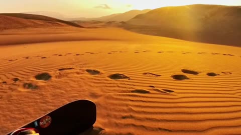 Sandboarding On The Dunes