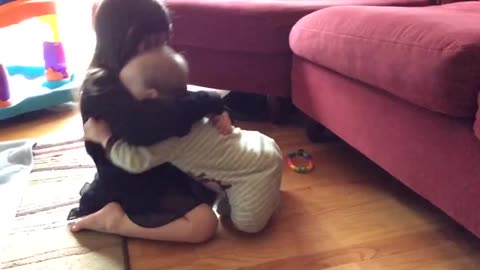 Big Sister And Baby Brother Share A Precious Moment