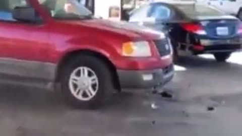 Dude tries to drift his SUV around gas pumps goes wrong