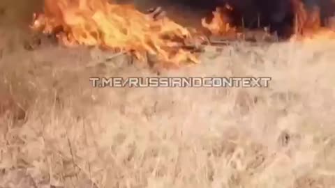 Russians Trying to Drive a Self-Propelled Heavy Gun Engulfed in Flames After Multiple Drone Strikes