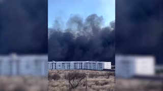 Black smoke rises from raging wildfires in Hawaii