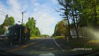 Distracted driver jumps curb