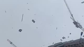 Building Materials Fly Off a Building During a Storm