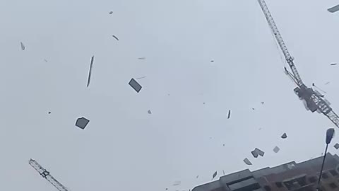 Building Materials Fly Off a Building During a Storm