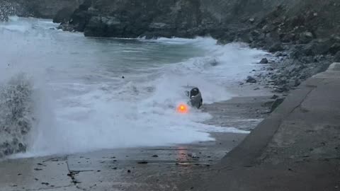 Large Waves Swallow SUV Stuck on Beach