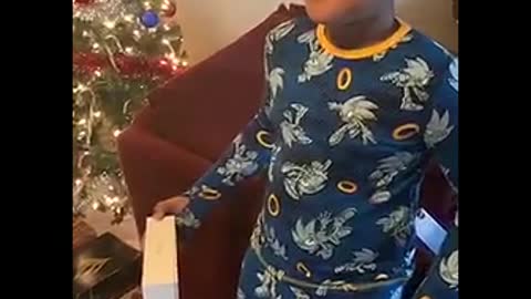 Boy Bamboozled by the Packaging
