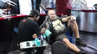 A man getting a tattoo.