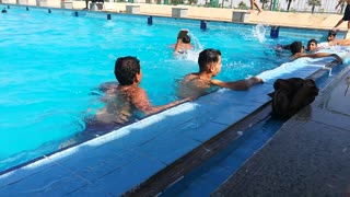 Boys Enjoys Summer In Pool