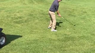 Guy misses two shots hit by golf cart