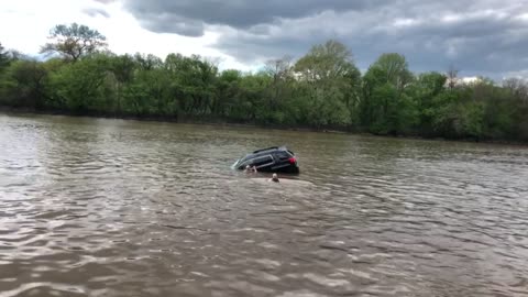 Woman Rescued from Sinking Car