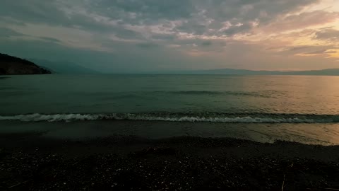Lake Ohrid sunset wave splashing calmly on the shore