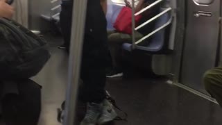 Guy black shirt black pants doing pulls up in subway train