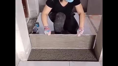 Young Girl With Great Tiling Skills