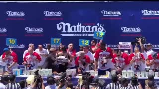 Joey Chestnut CHOKES OUT Leftist Protestor During Nathan's Hot Dog Eating Competition