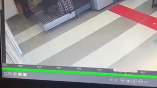 dude goes through the baggage check machine with his luggage.