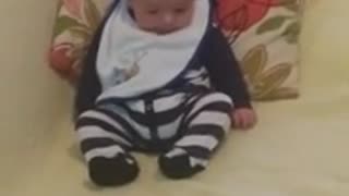 Adorable baby discovers feet for first time