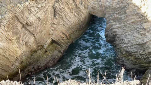 Collapsed cave now a sink hole along the California coastline.