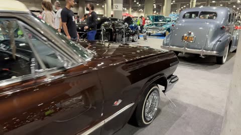 "Stunning 1965 Impala Lowrider in Motion: A Classic Ride Reimagined"