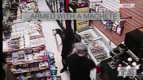 Robber pulls out machete; Clerk pulls out sword