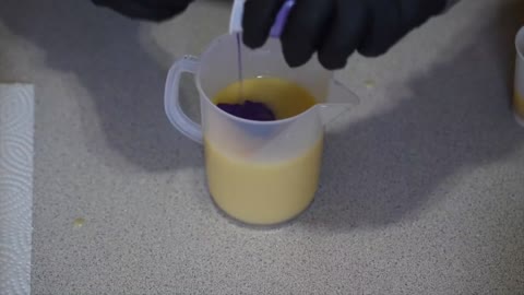 Put The Liquid In A Container With Purple Powder
