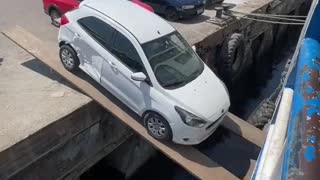 This is a real video of How cars get onboard in Brazil. Unbelievable