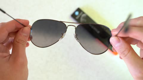 How to apply your StickTite Lenses - Convert your Sunglasses to magnified reading glasses.