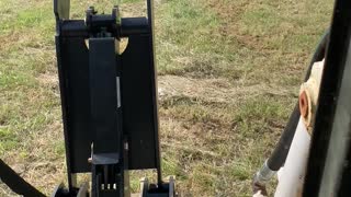 Worlds Largest Wheeled skid steer picking car sized rocks out of the field!