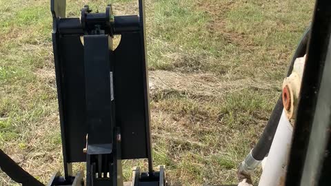 Worlds Largest Wheeled skid steer picking car sized rocks out of the field!