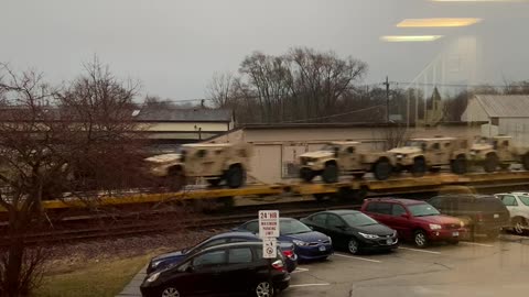 A Multitude of Military Vehicles Heading into Chicago