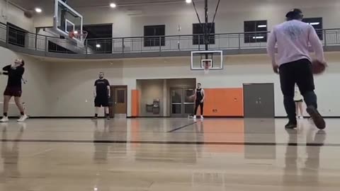 white boy sinks half court shot