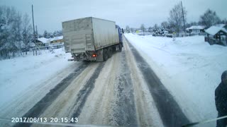 Woman Lies Down in Front of Approaching Truck