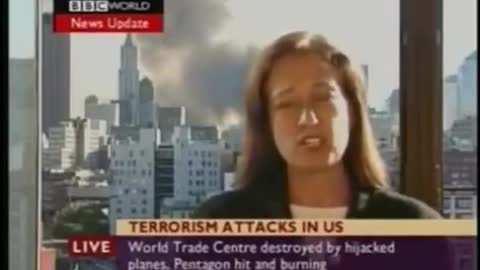 9/11 WTC attack. Report about WTC-7 collapse when the bulding is still in the background