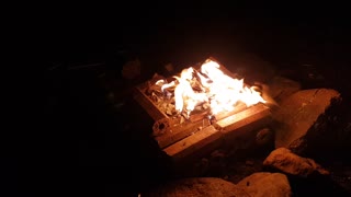 Sounds of a campfire and a river.