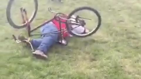 Backyard daredevil on mountain bike tries to jump bond fire