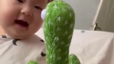 Adorable BABY talking to cactus