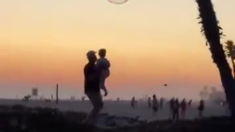 Dad helped his kid pop the bubble in the most dad way possible. Great dad.
