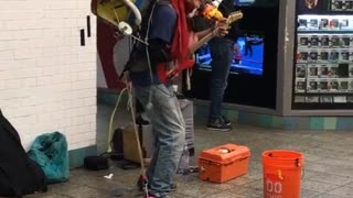 Old man playing colorful drums instrument combination